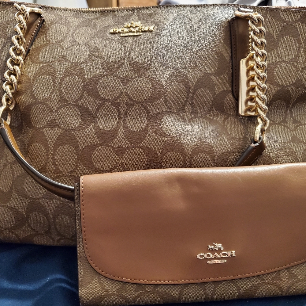 Brown coach bag with matching coach wallet.